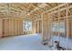 Large bedroom under construction with high ceilings and multiple windows at 1284 Six Sisters St, Dacula, GA 30019