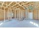 Unfinished bedroom with framed walls and ample natural light at 1284 Six Sisters St, Dacula, GA 30019