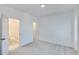 Bright bedroom with carpet flooring, private bathroom access, and neutral wall colors at 1284 Six Sisters St, Dacula, GA 30019