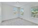 Bright bedroom with neutral carpeting and large windows at 1284 Six Sisters St, Dacula, GA 30019