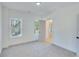 Spacious bedroom with grey carpeting and access to exterior at 1284 Six Sisters St, Dacula, GA 30019