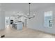 Elegant dining room featuring hardwood floors and a modern chandelier at 1284 Six Sisters St, Dacula, GA 30019