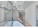 Bright entryway with stylish staircase and glass front door at 1284 Six Sisters St, Dacula, GA 30019