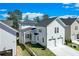 Two story home with two car garage and light gray siding at 1284 Six Sisters St, Dacula, GA 30019