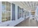 Exterior features a porch with gray shutters and wooden flooring at 1284 Six Sisters St, Dacula, GA 30019