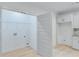Laundry area with built-in cabinets and shelving at 1284 Six Sisters St, Dacula, GA 30019