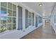 Porch with gray shutters and wood flooring at 1284 Six Sisters St, Dacula, GA 30019