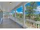 Long porch with white columns and wooded views at 1284 Six Sisters St, Dacula, GA 30019