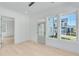 Bright sunroom features hardwood floors, multiple windows, and access to the backyard at 1284 Six Sisters St, Dacula, GA 30019