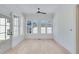 Sunroom with hardwood floors, ceiling fan, and multiple windows at 1284 Six Sisters St, Dacula, GA 30019