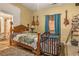 Bedroom with crib and wood bed frame at 4115 Hicks Rd, Austell, GA 30106