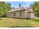 Beige siding house with a large yard and mature trees at 4115 Hicks Rd, Austell, GA 30106