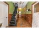 Long entryway with wood floors and staircase at 4115 Hicks Rd, Austell, GA 30106