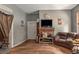 Living room with fireplace and brown couch at 4115 Hicks Rd, Austell, GA 30106