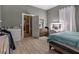 Spacious bedroom with ample closet space and wood-look flooring at 4115 Hicks Rd, Austell, GA 30106