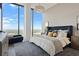 Main bedroom with city views and luxurious bedding at 788 W Marietta Nw St # 1803, Atlanta, GA 30318