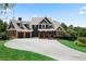 Stunning two-story home with a large driveway and beautiful landscaping at 14 Lake Point Se Dr, Cartersville, GA 30121