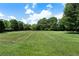 Large grassy backyard with plenty of space for recreation at 14 Lake Point Se Dr, Cartersville, GA 30121