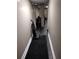 Long narrow basement hallway with a vacuum cleaner at 1005 Ashby Ter, Atlanta, GA 30314
