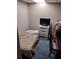 Small basement bedroom with a bed, dresser, and TV at 1005 Ashby Ter, Atlanta, GA 30314