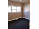 Simple bedroom with dark grey carpet and neutral walls at 1005 Ashby Ter, Atlanta, GA 30314