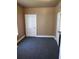 Simple bedroom with dark grey carpet and neutral walls at 1005 Ashby Ter, Atlanta, GA 30314