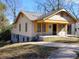 Charming yellow and beige house with a spacious front porch at 1005 Ashby Ter, Atlanta, GA 30314