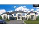 Luxury home with a large driveway and manicured landscaping at 1809 Trinidad, Stockbridge, GA 30281