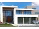 Modern house exterior with three car garage at 1711 Grand Cayman, Stockbridge, GA 30281