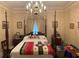 Spacious bedroom with a large bed and antique furniture at 3355 Smithtown Rd, Suwanee, GA 30024