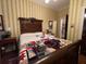Charming bedroom with antique sleigh bed and quilt at 3355 Smithtown Rd, Suwanee, GA 30024