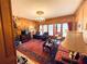 Spacious living room with hardwood floors, fireplace, and large windows at 3355 Smithtown Rd, Suwanee, GA 30024