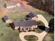 Aerial view of house, detached garages, and circular driveway at 3355 Smithtown Rd, Suwanee, GA 30024