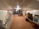 Spacious attic area with plywood flooring, brick chimney, and storage at 3355 Smithtown Rd, Suwanee, GA 30024