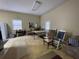 Common area with rocking chairs, a table, and a sofa at 3355 Smithtown Rd, Suwanee, GA 30024
