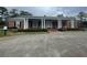 Brick house with a large front porch and columns at 3355 Smithtown Rd, Suwanee, GA 30024