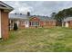 Brick house with metal roof and large backyard at 3355 Smithtown Rd, Suwanee, GA 30024