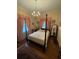 Bedroom with a four-poster bed and pink curtains at 3355 Smithtown Rd, Suwanee, GA 30024