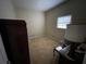 Simple bedroom with carpeted floor, window, and a wardrobe at 3355 Smithtown Rd, Suwanee, GA 30024