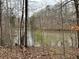 Peaceful lakefront property with mature trees at 3355 Smithtown Rd, Suwanee, GA 30024