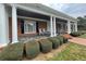 Brick house with a large front porch and columns at 3355 Smithtown Rd, Suwanee, GA 30024