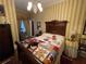 Cosy bedroom with antique sleigh bed and quilt at 3355 Smithtown Rd, Suwanee, GA 30024
