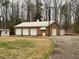Detached three-car brick garage with extra storage at 3355 Smithtown Rd, Suwanee, GA 30024