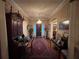 Elegant entryway with hardwood floors and antique furniture at 3355 Smithtown Rd, Suwanee, GA 30024