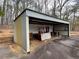 Metal storage shed with forklift and other items at 3355 Smithtown Rd, Suwanee, GA 30024