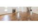 Bright living room featuring hardwood floors, fireplace, and high ceilings at 1410 Eastland Se Rd, Atlanta, GA 30316