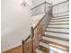 Elegant staircase with dark wood and wrought iron railing at 1410 Eastland Se Rd, Atlanta, GA 30316