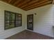 Covered deck with window, door and wood ceiling at 1410 Eastland Se Rd, Atlanta, GA 30316