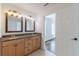 Double vanity bathroom with granite countertop and large mirrors at 1410 Eastland Se Rd, Atlanta, GA 30316