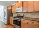 Kitchen stove and oven area with granite countertops at 1410 Eastland Se Rd, Atlanta, GA 30316